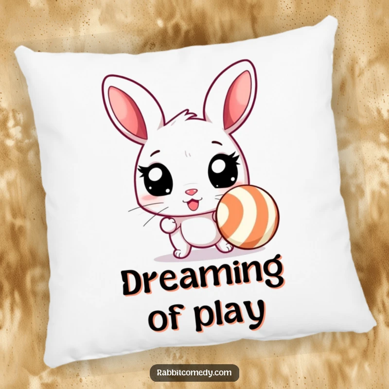 Funny rabbit pillow featuring an excited rabbit with wide eyes, ready to chase a bouncing, striped ball, offering humorous comfort.