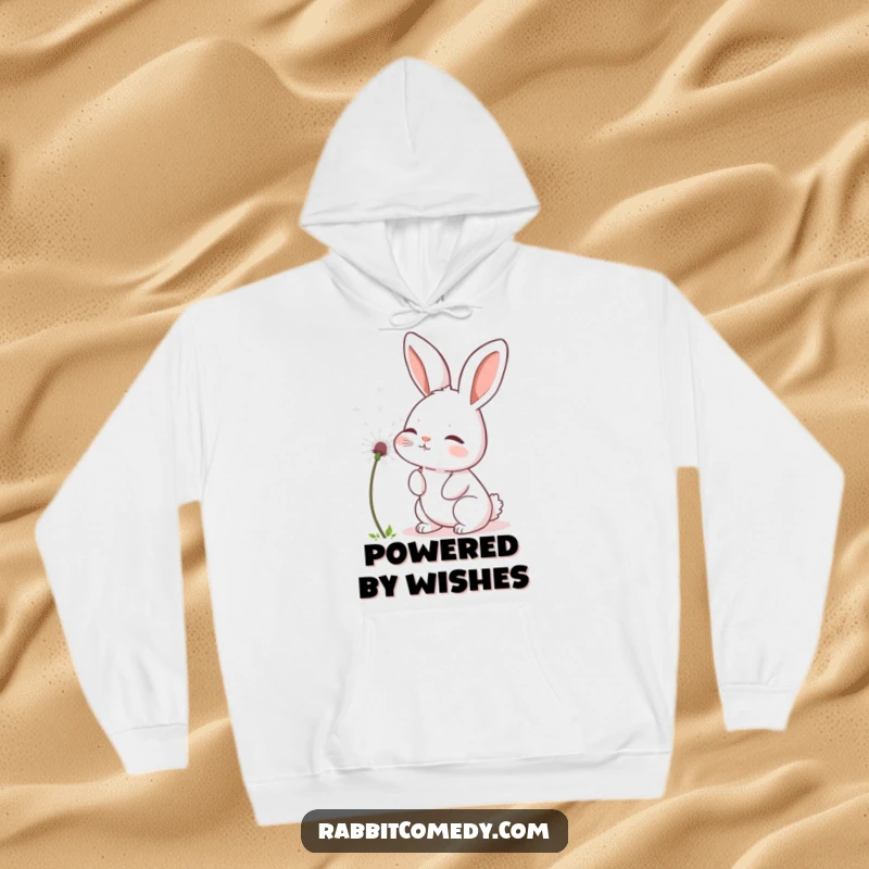 Funny rabbit hoodie depicting a soft bunny gently blowing a fluffy dandelion seed, emanating warmth and tranquility.