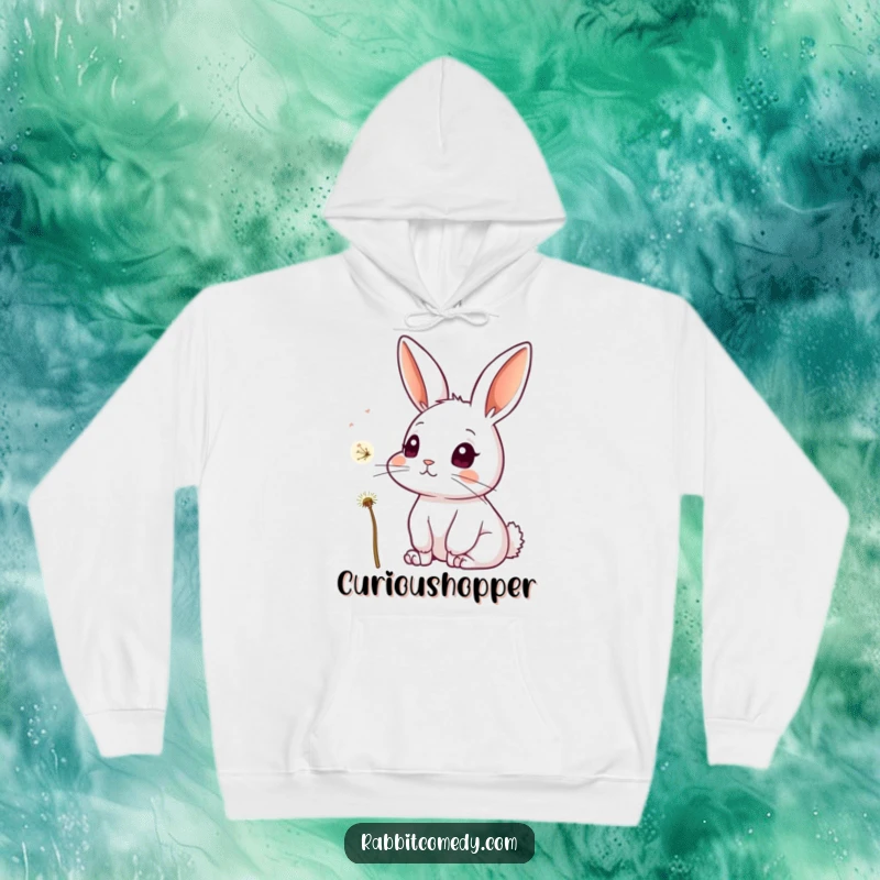 Funny hoodie depicting a rabbit with attentive ears and wide, curious eyes, focused on a single, floating dandelion seed drifting by.