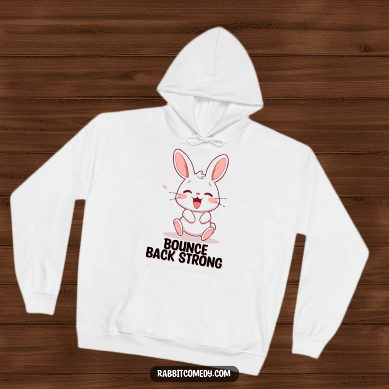 Funny rabbit character mid-stumble, then recovering with a happy squeak, printed on a warm and humorous hoodie.