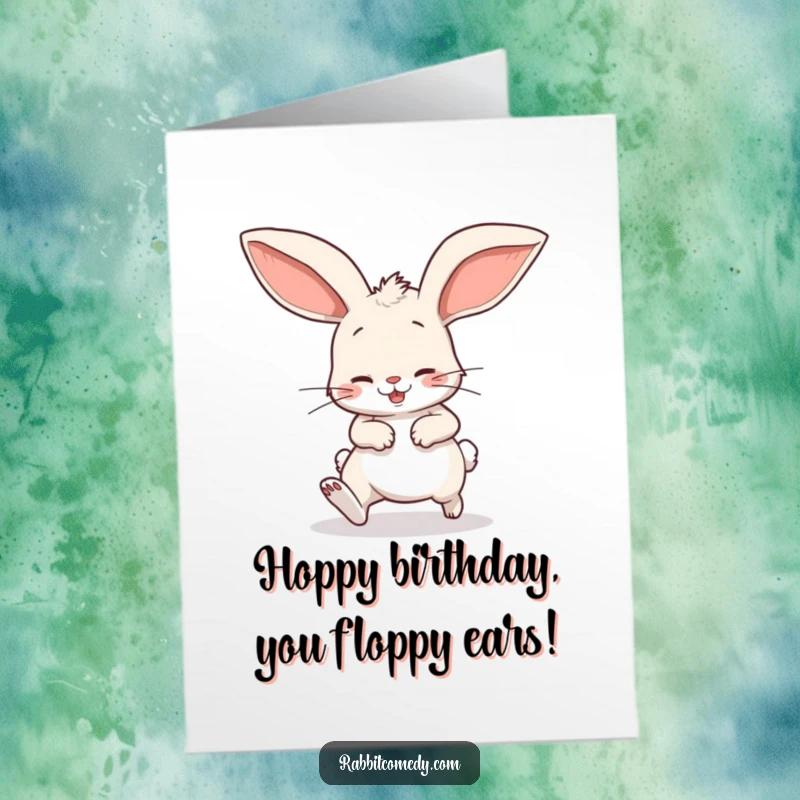 Funny free printable birthday card: A rabbit comically stumbles wearing oversized, floppy ears.
