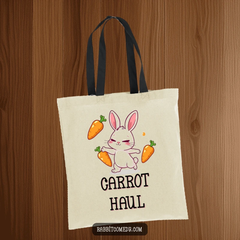 Funny rabbit tote bag featuring a rabbit character playfully juggling three shiny carrots with intense focus and a determined squint.